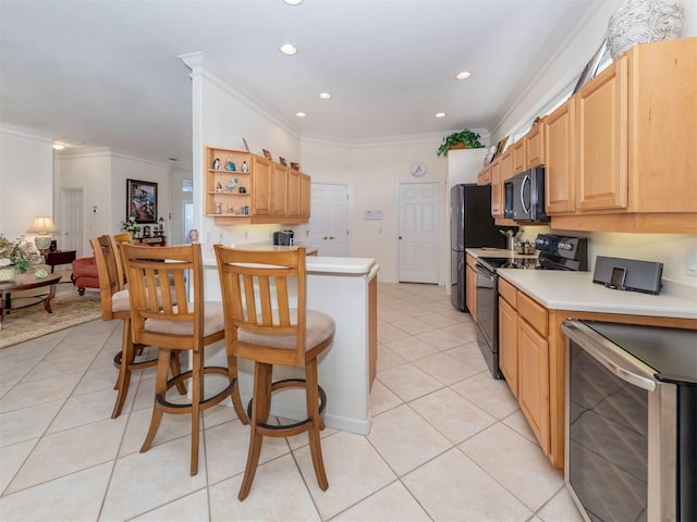 kitchen featuring light tile patterned flooring, crown molding, light brown cabinets, stainless steel appliances, and beverage cooler