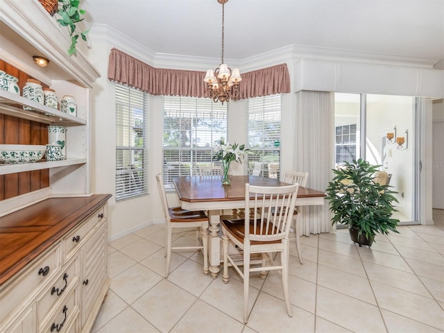 tiled dining space featuring crown molding and a chandelier