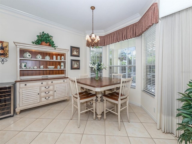 tiled dining space featuring an inviting chandelier, ornamental molding, and beverage cooler