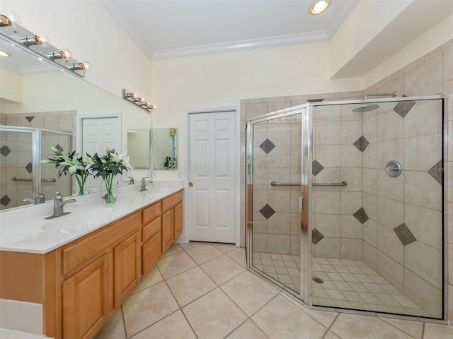 bathroom featuring crown molding, tile patterned floors, a shower with door, and vanity