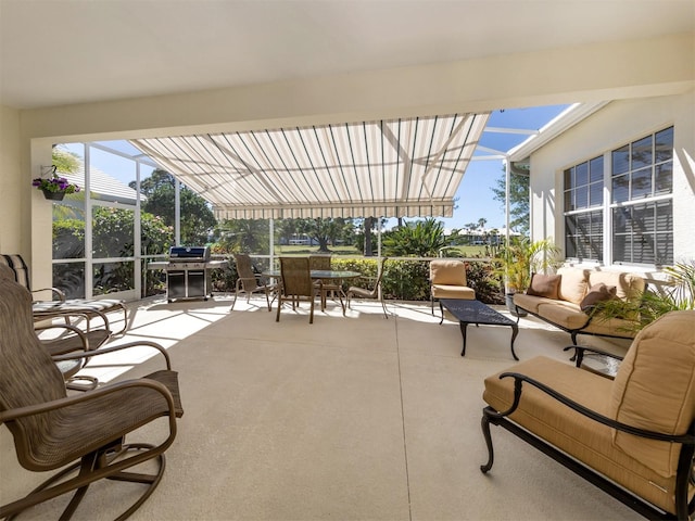 view of patio with area for grilling, a lanai, and an outdoor hangout area