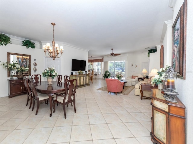 tiled dining area featuring ceiling fan with notable chandelier and ornamental molding