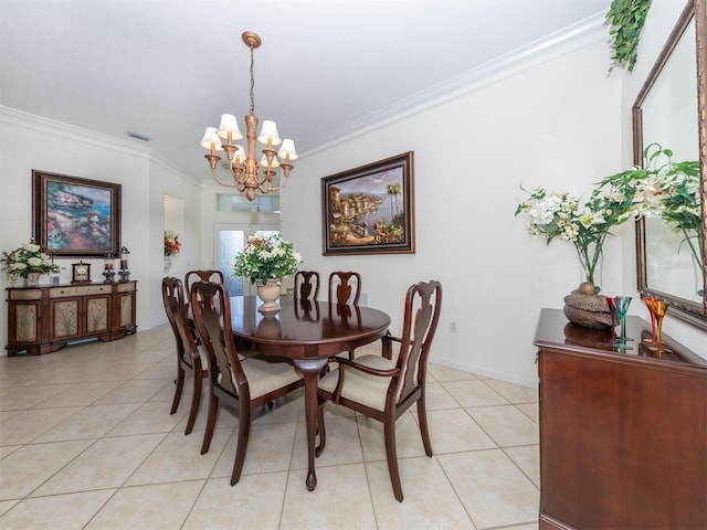 dining space featuring crown molding, a chandelier, and light tile patterned flooring