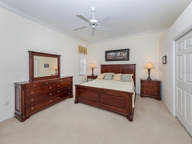 carpeted bedroom with crown molding and ceiling fan