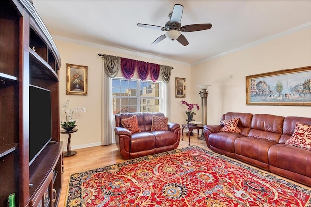 living room featuring hardwood / wood-style floors, ceiling fan, and ornamental molding