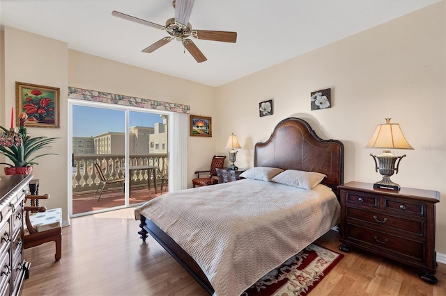 bedroom with hardwood / wood-style floors, ceiling fan, and access to exterior