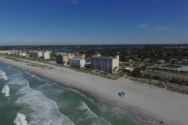 bird's eye view featuring a view of the beach and a water view