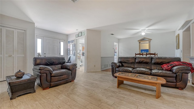 living room featuring ceiling fan and light wood-type flooring