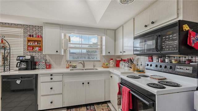 kitchen with a textured ceiling, sink, dark tile flooring, tasteful backsplash, and black appliances