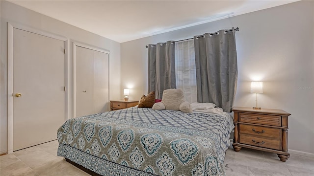 tiled bedroom featuring a closet