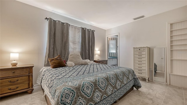 bedroom with light tile floors