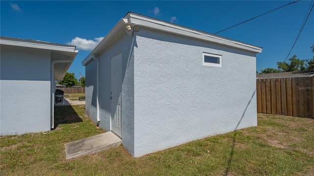 view of home's exterior with a yard