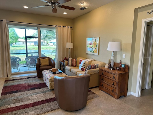 living room with ceiling fan and light tile floors