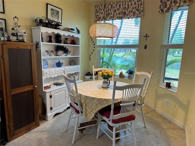 dining area with a healthy amount of sunlight and light tile floors