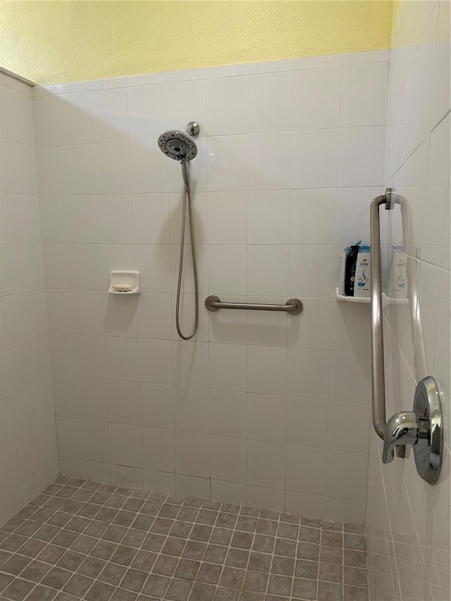 bathroom with a tile shower