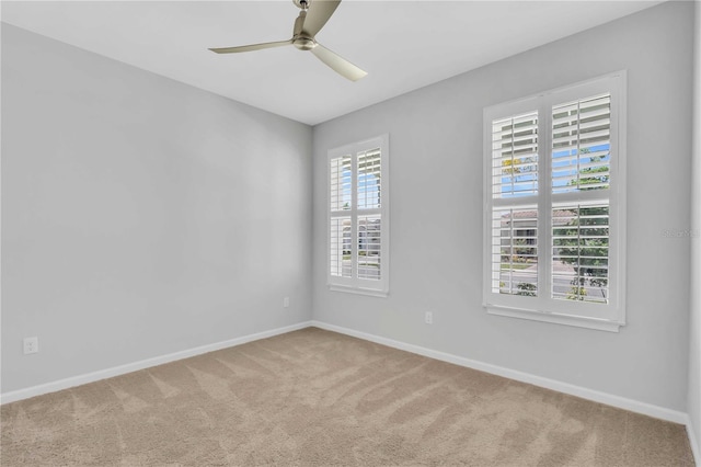 carpeted empty room with ceiling fan