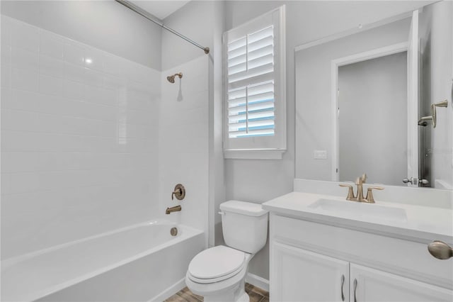 full bathroom featuring bathing tub / shower combination, vanity, and toilet