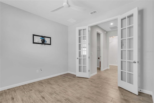 unfurnished room featuring french doors and ceiling fan