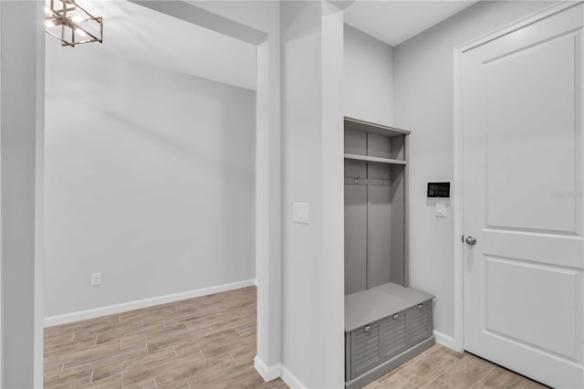 mudroom with a notable chandelier