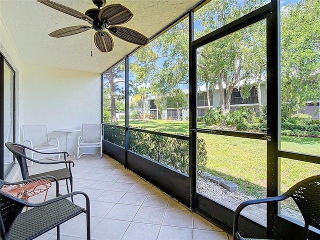 sunroom / solarium with ceiling fan