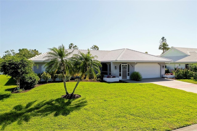 single story home with a garage and a front lawn