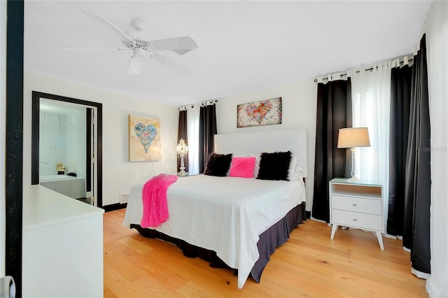 bedroom with hardwood / wood-style floors and ceiling fan