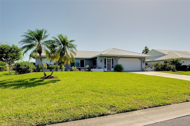 ranch-style home with a garage and a front lawn