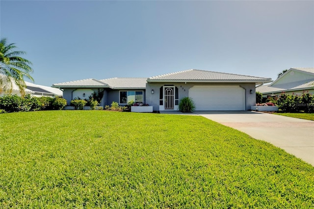 ranch-style home with a garage and a front yard