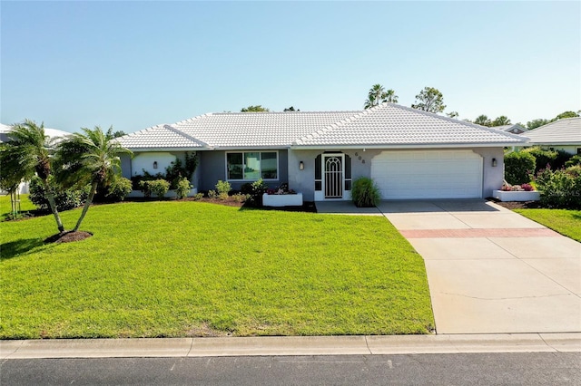 ranch-style house with a garage and a front lawn