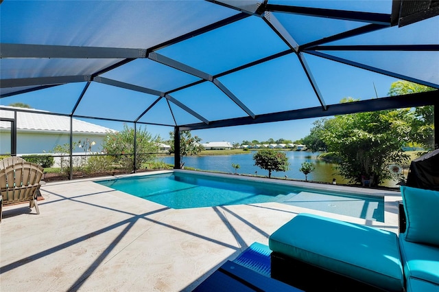 view of swimming pool featuring a patio, a water view, and glass enclosure