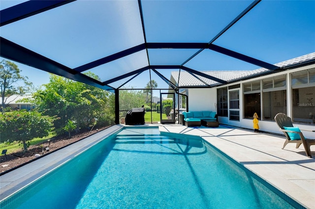 view of pool with a lanai and a patio area