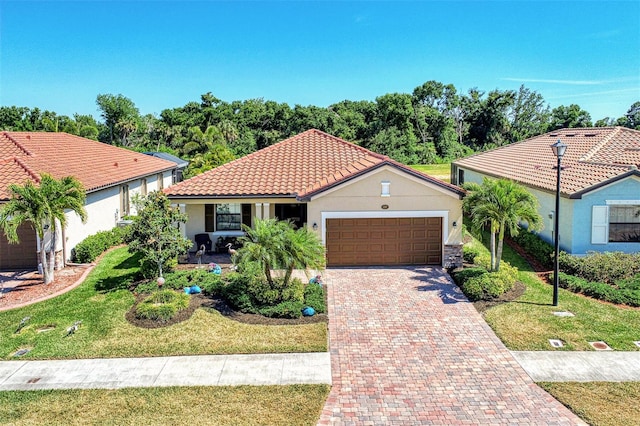 view of front of property with a garage and a front yard