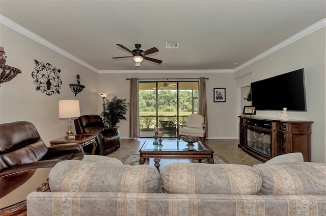 tiled living room featuring ceiling fan and ornamental molding