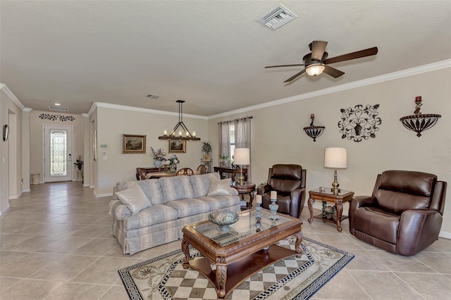 tiled living room with ceiling fan with notable chandelier, a healthy amount of sunlight, and ornamental molding