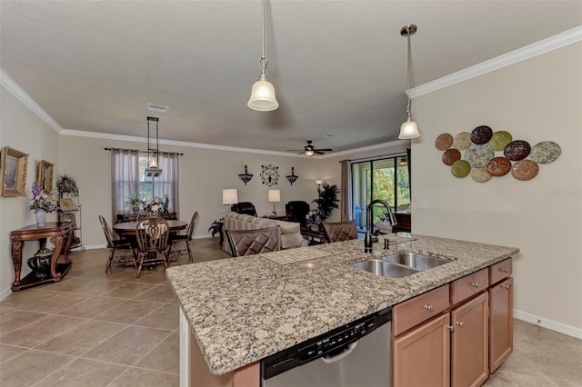 kitchen with decorative light fixtures, ceiling fan, dishwasher, a kitchen island with sink, and sink