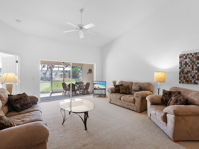 carpeted living room featuring ceiling fan and high vaulted ceiling