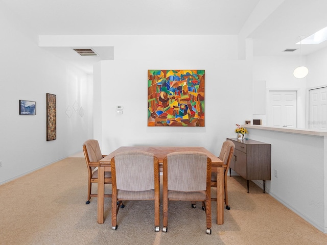 view of carpeted dining area