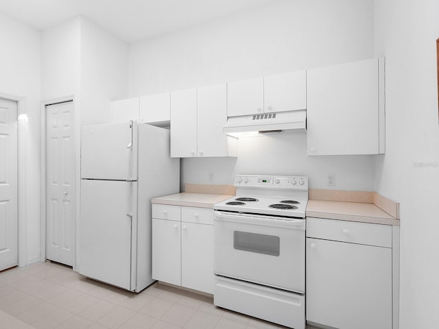 kitchen featuring white cabinetry and white appliances