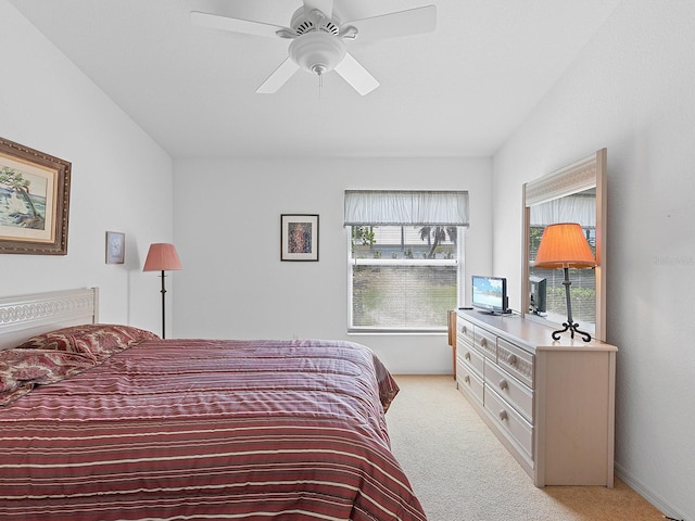 bedroom featuring ceiling fan and light carpet