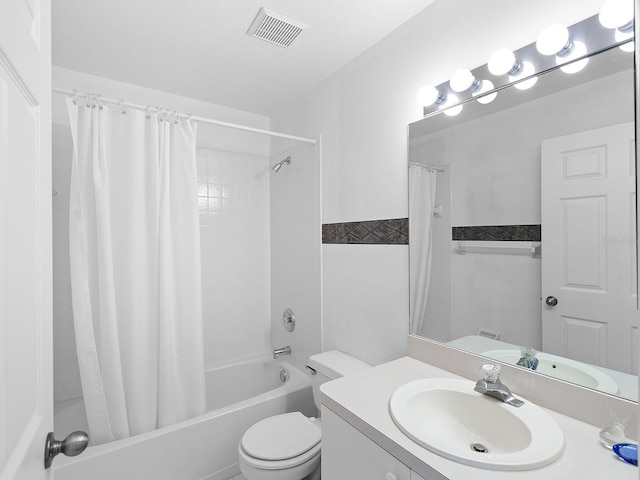 full bathroom with vanity, toilet, shower / bathtub combination with curtain, and a textured ceiling