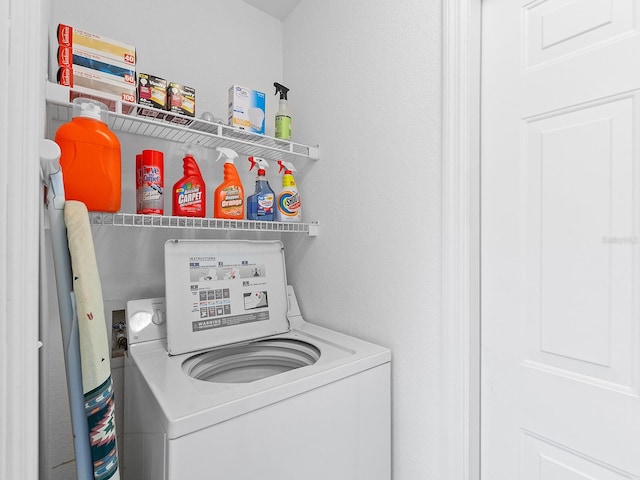 washroom with washer / clothes dryer