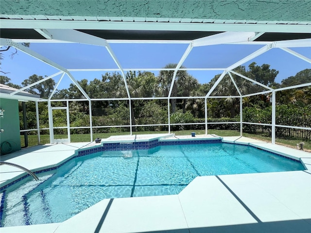 view of pool featuring glass enclosure