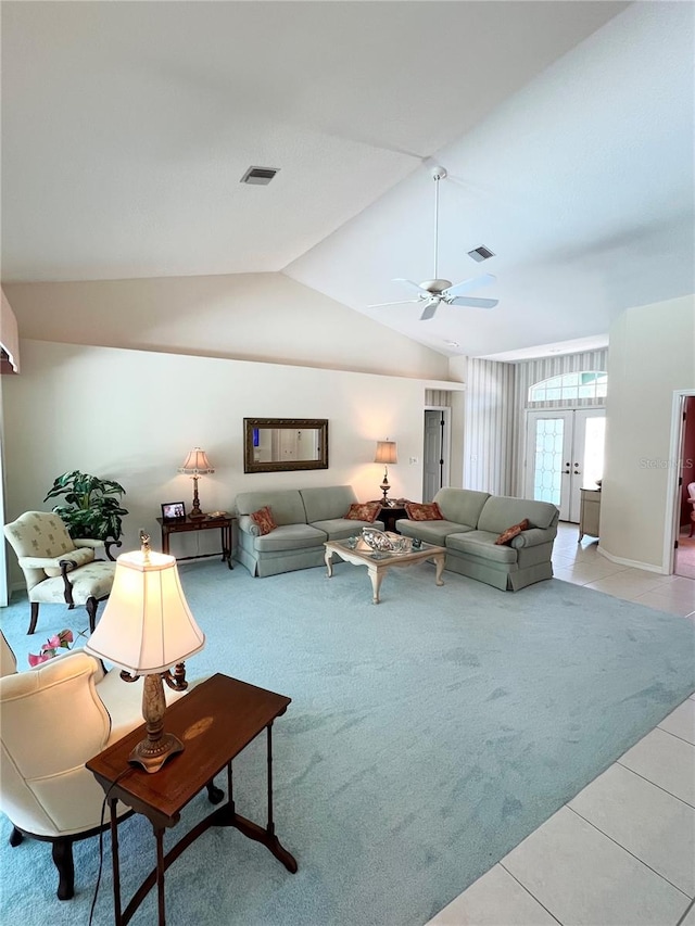 living room featuring french doors, ceiling fan, lofted ceiling, and light tile patterned flooring