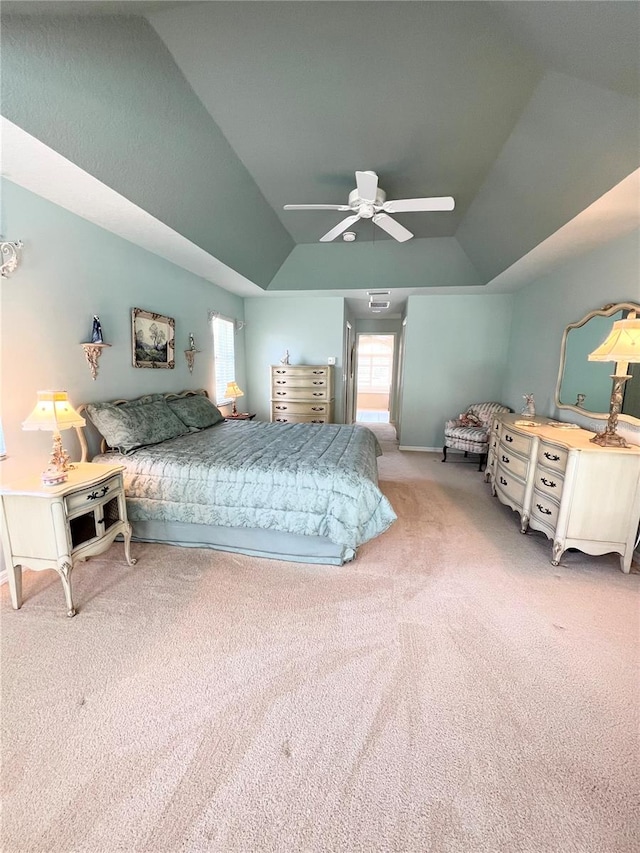 bedroom with carpet flooring, ceiling fan, and lofted ceiling