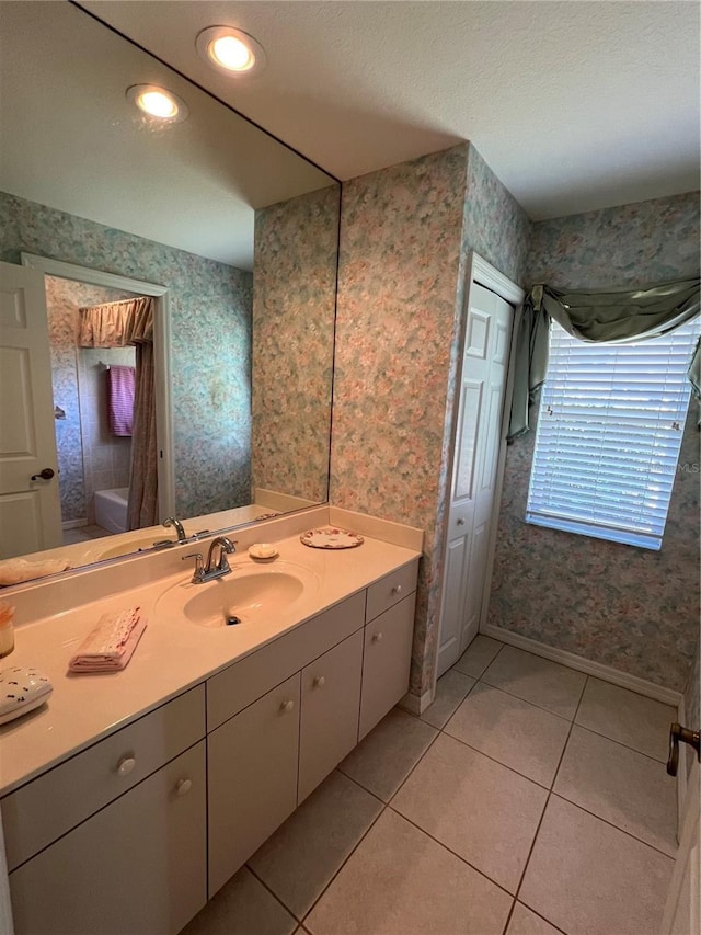 bathroom featuring tile patterned flooring and vanity