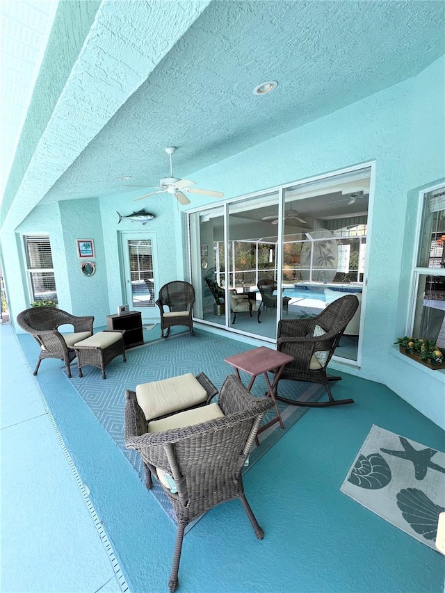 view of patio / terrace featuring ceiling fan