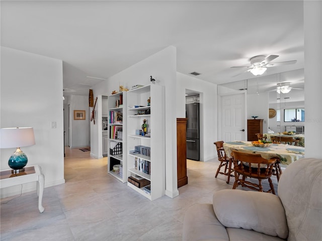 interior space with ceiling fan