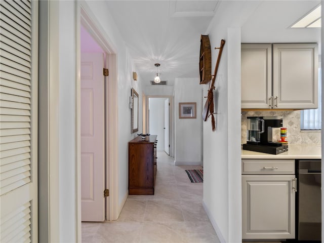 hall featuring light tile patterned floors