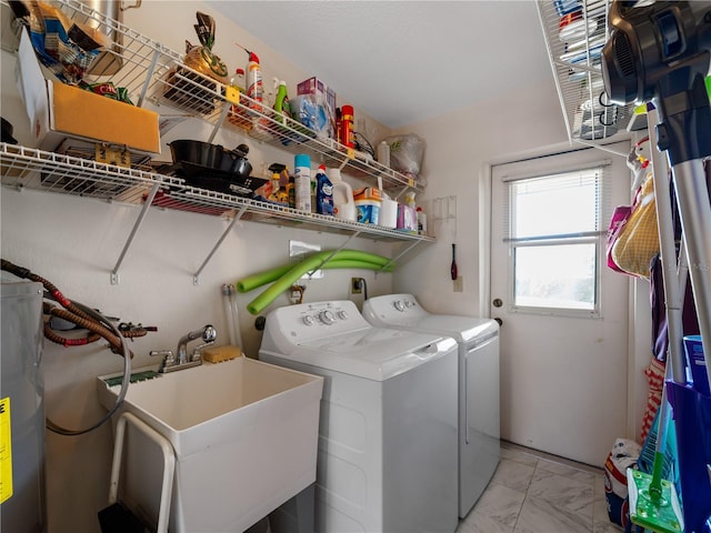 washroom with washer and dryer, sink, and electric water heater