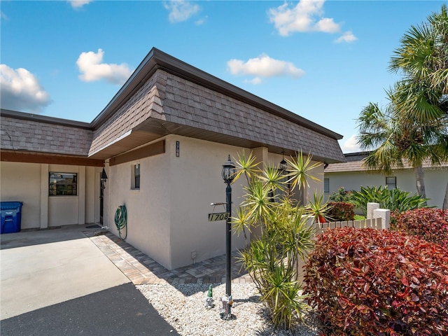 view of side of property with a patio area